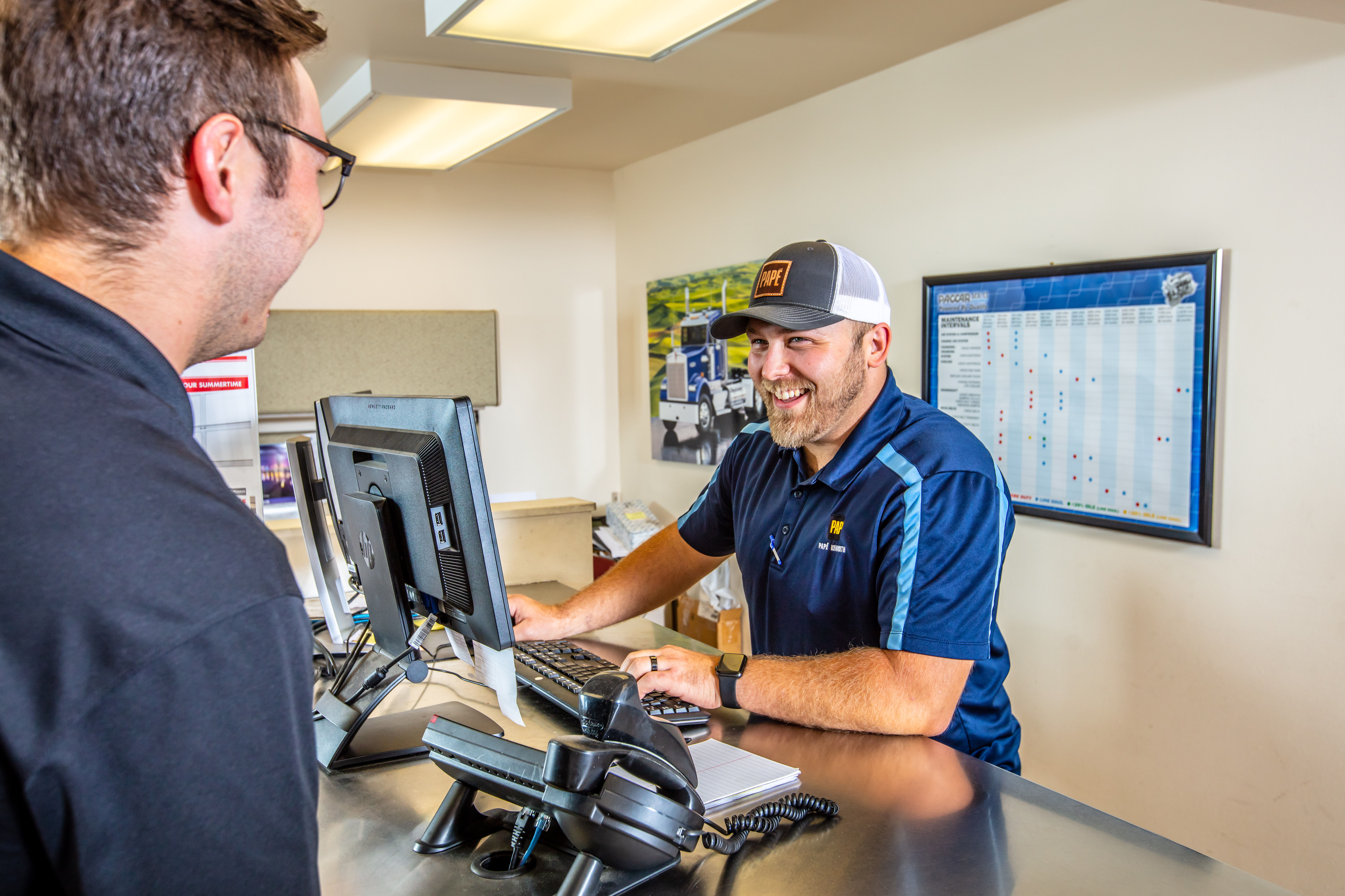 Papé technician using diagnostic tools to identify and resolve equipment issues efficiently.